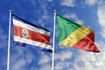 3D illustration. Costa Rica and Republic of Congo flags waving in the sky. High detailed waving flag. 3D render. Flags fluttered in the cloudy sky, symbolizing diplomatic relations.