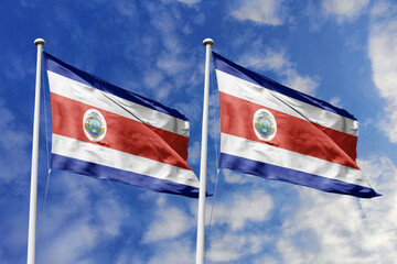 3D illustration. Costa Rica and Costa Rica flags waving in the sky. High detailed waving flag. 3D render. Flags fluttered in the cloudy sky, symbolizing diplomatic relations.