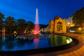 Marianske Lazne (Marienbad) - Main colonnade and singing fountain at night - center of great famous Bohemian spa town in the west part of the Czech Republic (region Karlovy Vary)	
