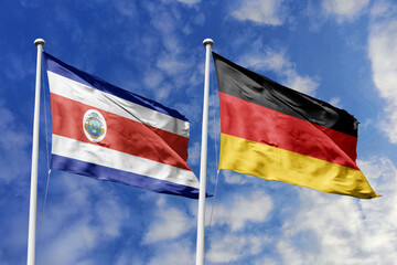 3D illustration. Costa Rica and Germany flags waving in the sky. High detailed waving flag. 3D...