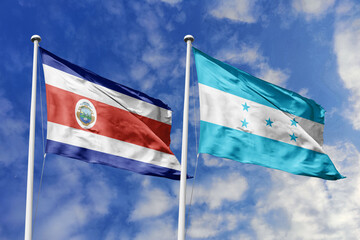 3D illustration. Costa Rica and Honduras flags waving in the sky. High detailed waving flag. 3D...
