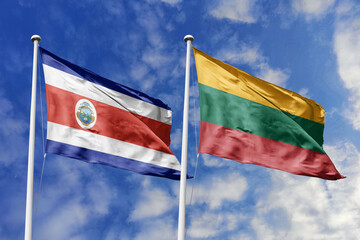 Costa Rica and Lithuania flags proudly waving against a vibrant blue sky, symbolizing international relations, friendship, and diplomacy between the two nations.