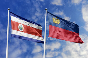 Costa Rica and Liechtenstein flags proudly waving against a vibrant blue sky, symbolizing...