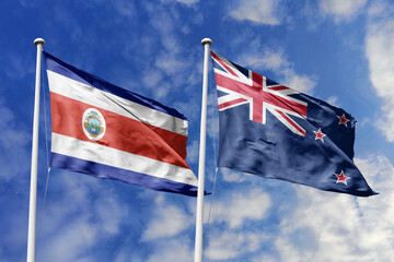Costa Rica and New Zealand flags proudly waving against a vibrant blue sky, symbolizing...