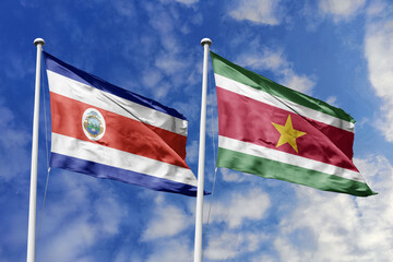 Costa Rica and Suriname National Flags Waving Harmoniously Under a Clear Blue Sky, Symbolizing Diplomatic Bonds and Shared South American-Central American Ties.