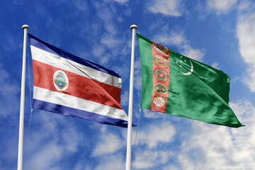 Costa Rica and Turkmenistan National Flags Waving Harmoniously Under a Vivid Blue Sky, Representing Bilateral Relations and Global Cooperation.