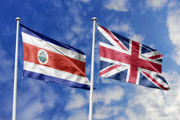 Flags of Costa Rica and the United Kingdom Waving Together Under a Bright Blue Sky, Symbolizing Diplomatic and Historical Ties.