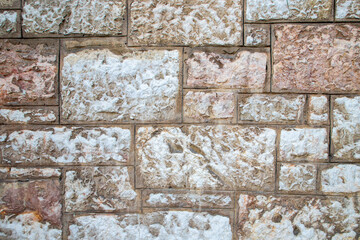 Close-Up of a Textured Stone Wall with Light and Neutral Tones