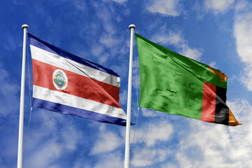 Flags of Costa Rica and Zambia Waving Against a Clear Blue Sky with Clouds, Symbolizing Diplomatic Relations and Global Partnership.