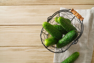 Raw cucumber on wooden table. Top view.