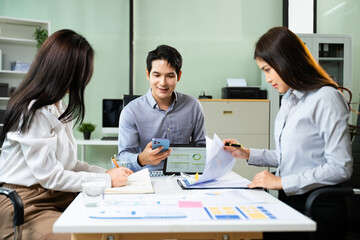 Young business professionals working together in modern office, using tablet and notebooks Startup, teamwork