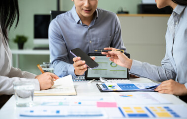 Business documents on office table with smart phone and calculator digital tablet and graph...
