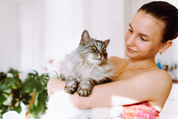Portrait young woman with pet cat
