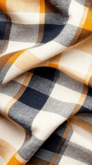 Obraz premium Close up of yellow, navy, and white plaid cotton fabric with soft folds and a textured surface detail