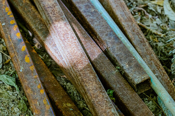 Steel rods bars, Metal, and Iron reinforcement lying on the ground on the construction site for material used for reinforcing concrete building construction. Concept background textured architecture