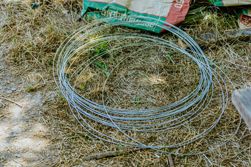 Stack of galvanized wires on the ground. High quality photo