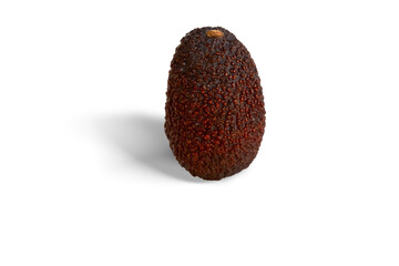 Ripe Hass Avocado on White Background. A single ripe Hass avocado with dark, textured skin placed...