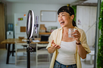Female japanese video blogger record new video about healthy lifestyle