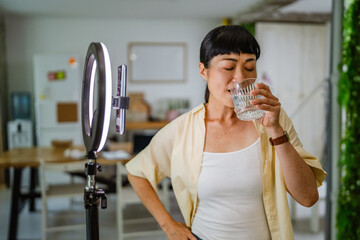 Female japanese video blogger record new video about healthy lifestyle