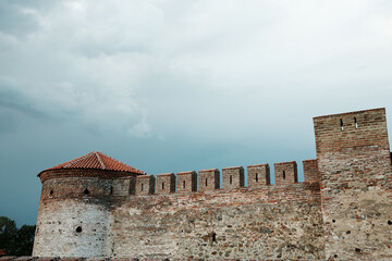 Close-up of the rounded corner tower of Fetislam Fortress in Serbia, showing brick textures and...