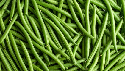 the image shows a large pile of vivid green objects stacked together. the objects appear to be long, thin, and cylindrical, arranged in a seemingly random manner