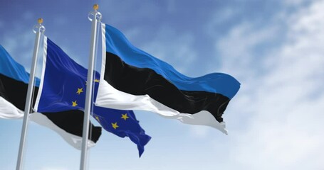 The flags of Estonia and the European Union waving together on a clear day