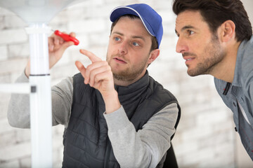 worker with apprentice