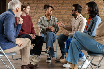 Diverse Group of People Participating in Support Group Meeting
