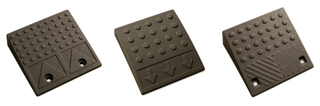 Set of tactile curb ramp plates in brown finish with raised dot patterns and warning indicators on transparent background
