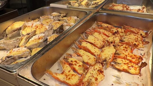 lobsters stuffed with cheese Rock lobster being barbecued, on open fire, stuffed with bacon cheese, tilt-down shot. High quality 4k footage