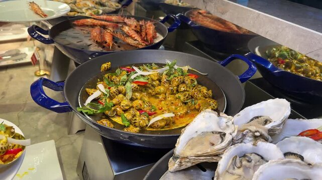 A buffet scene featuring a large fish dish being served at Cruiser. The fish is garnished with vegetables and sauce, placed in a chafing dish. A person is using tongs to serve the fish 