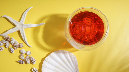 Arranged flat lay of summer beach holiday concept with cold refreshing summer beverage, strawberry...