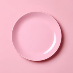 Obraz premium A pink empty plate on a matching background, offering a minimalist aesthetic. Perfect for culinary presentations. 