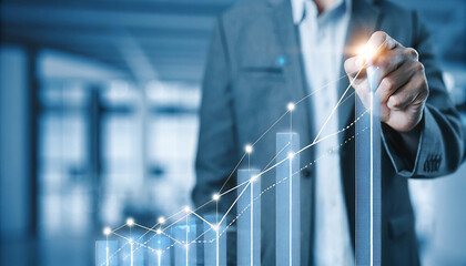 Businessman drawing a rising graph representing business growth and success strategy