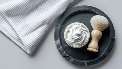 White Shaving Cream and Brush on Stone Tray with Striped Towel