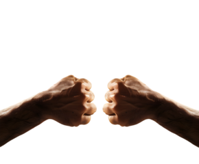 Two fists facing each other in a dimly lit setting against a stark black background in a studio shot on white background