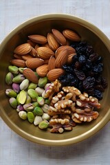 Top View Mixed Dry Fruits Brass Bowl Almonds Pistachios Raisins