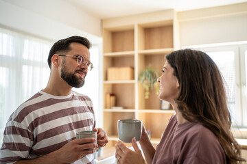 Couple enjoying a relaxing morning coffee together at home