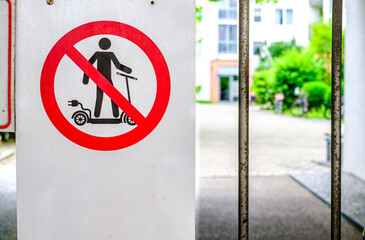 E-scooter usage prohibited sign displayed in urban area highlighting regulations against electric...
