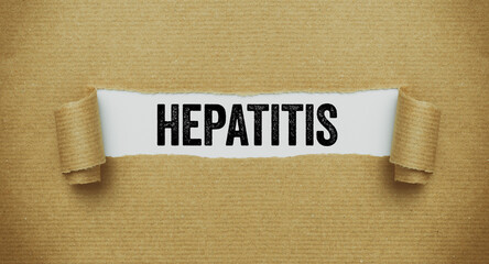 Torn paper revealing the word Hepatitis
