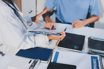 Young brunette woman having consultation at doctor office during