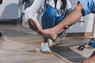 Physical therapist teaching a patient how to do exercises for his knee pain