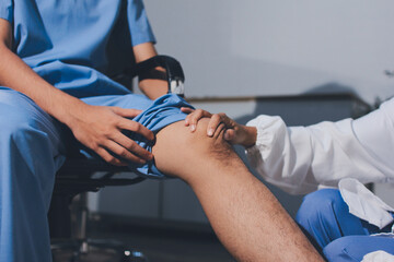 Physical therapist teaching a patient how to do exercises for his knee pain