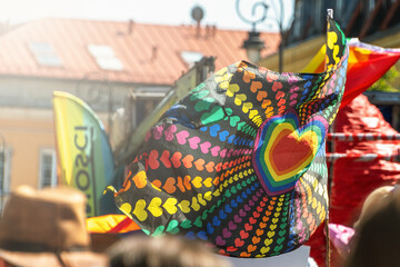 Vibrant heart pattern rainbow flag at outdoor pride celebration