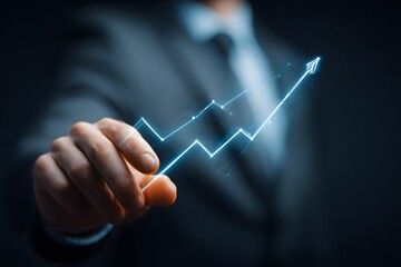 Businessman Pointing at Growing Graph.