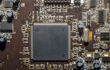 Printed circuit board with electronic components close up for science and technology project,...