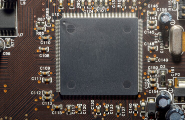 Printed circuit board with electronic components close up for science and technology project,...