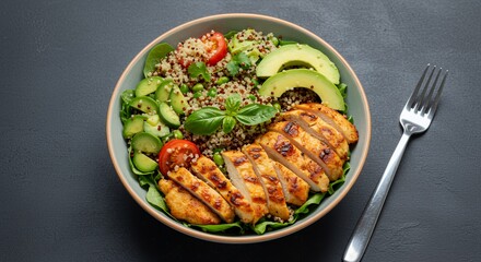 Savor the vibrant flavors of this healthy quinoa chicken bowl, a perfect blend of grilled chicken, fresh avocado, and colorful veggies.