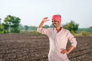 farmer standing at agriculture field and waiting some one