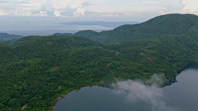 Lake Danao surrounded by lush mountains in Ormoc, Leyte Philippines, Aerial view
